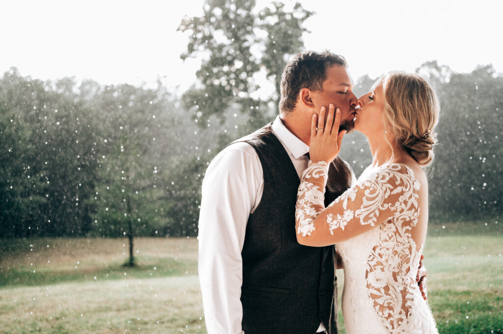 Kissing in the Rain | Wedding Reception | Moberly | Warm Photo Edits