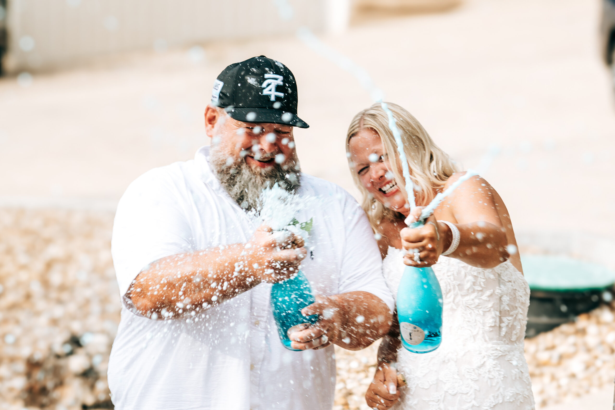 Champagne spray moment at the Lubbs wedding party at Camden on the Lake Resort