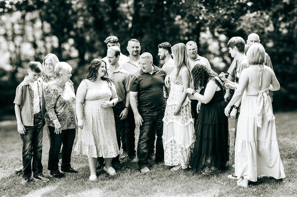 Family interacting naturally during outdoor family photography session