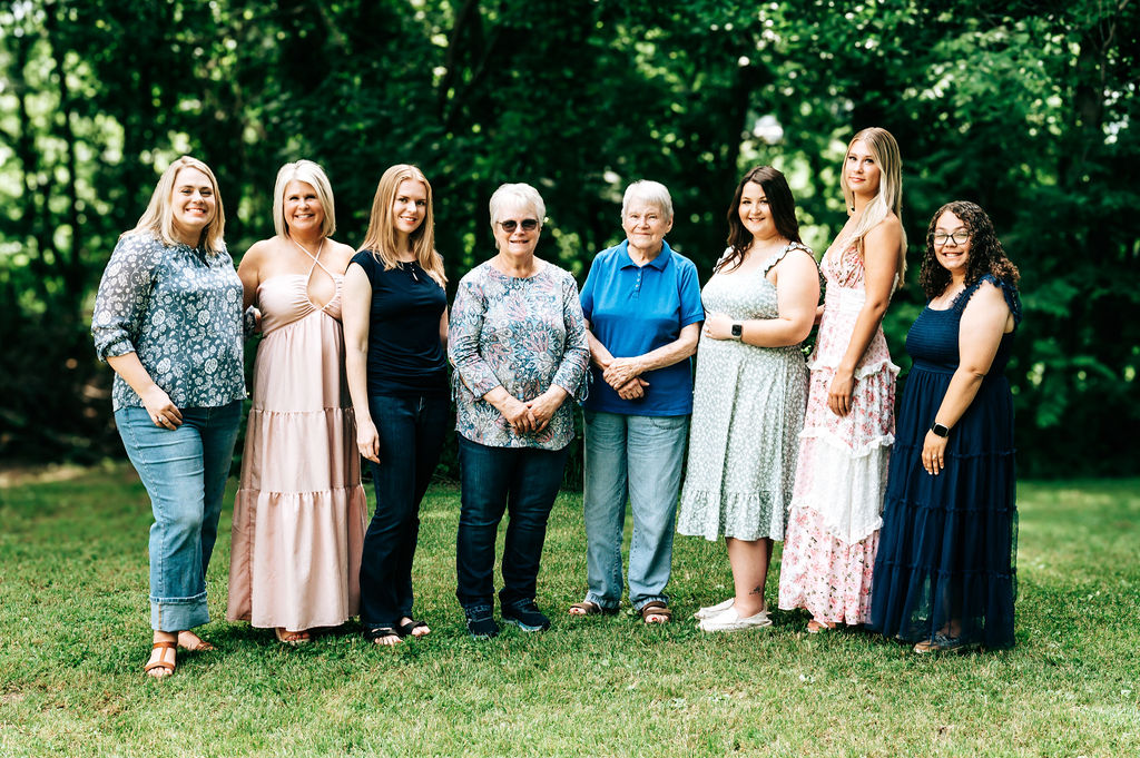 Woman celebrating family legacy during outdoor portrait session