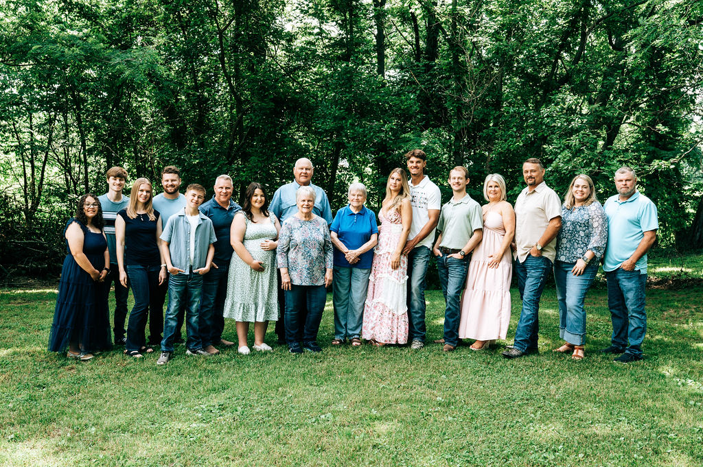 Siblings and parents gathered together for family photographs