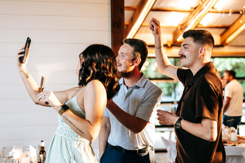 Wedding guests celebrating at the reception at Briarwood Hills in Iberia Missouri