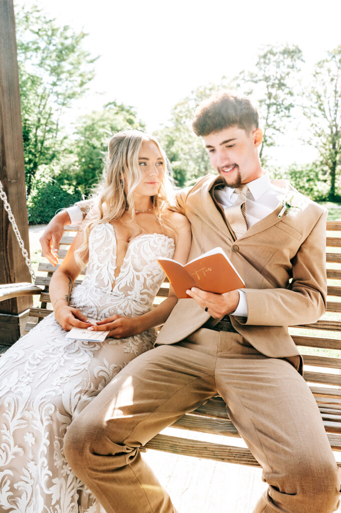 Intimate moment as the newlyweds exchange personal vows on the porch swing at Briarwood Hills