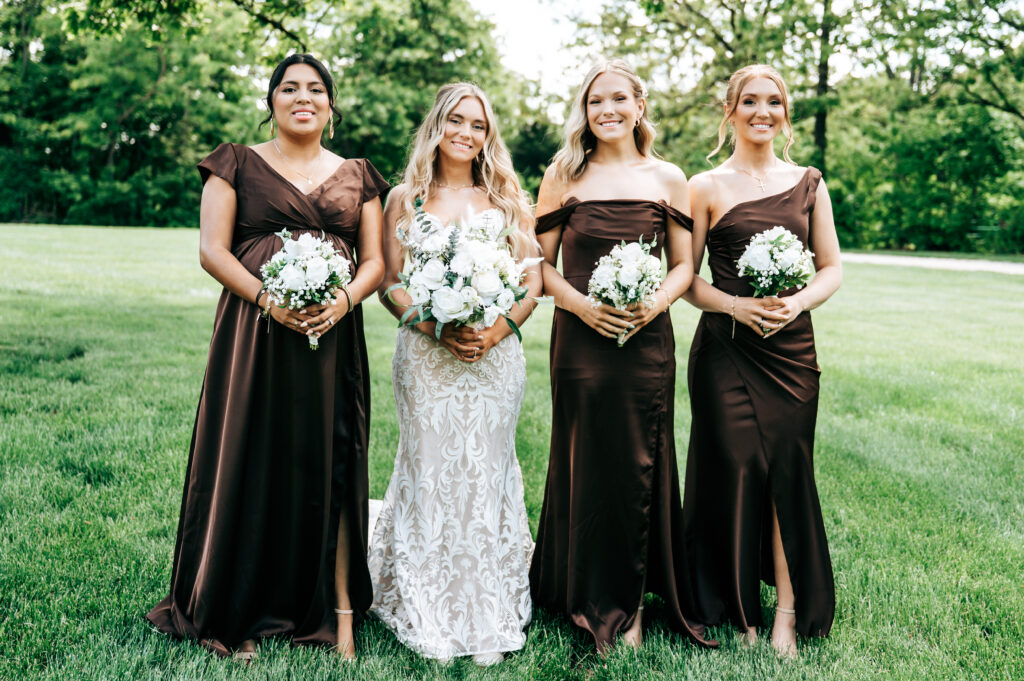 Bridesmaids with florals from East Main Floral & Gifts.