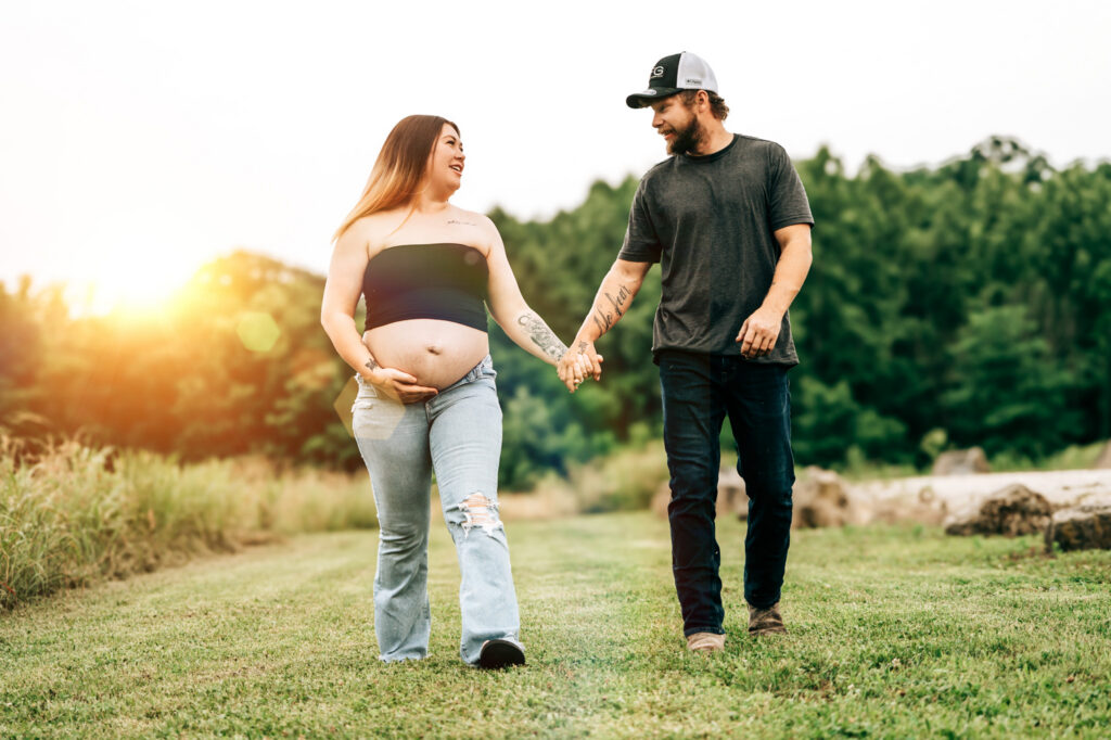 Expecting parents during maternity photography session in Eldon MO