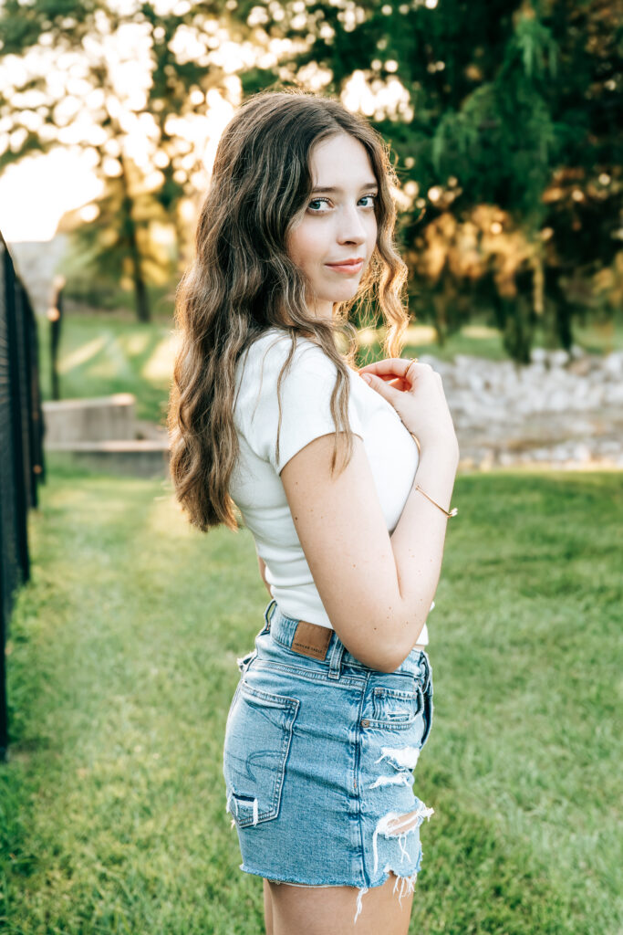 Paris High School senior smiling during outdoor senior pictures